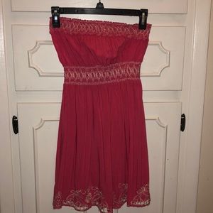 Pink strapless dress with floral pattern.